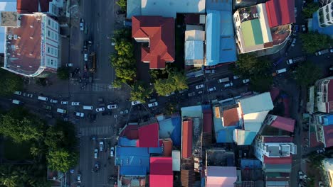 Aerial-Crazy-Crowded-Traffic-Streets-Phnom-Penh-Motorbike-Vehicle-Comunity-City-Cambodia-Crime-Human-Trafficking-Urban-Capitol-City-Buddhism-Tropical-Palm-Trees-Flying-Footage-South-East-Asian-4K