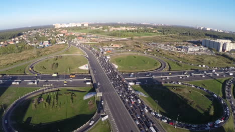 view from air of road interchange with city traffic