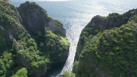 wang long bay of phi phi island hidden among towering cliffs, aerial