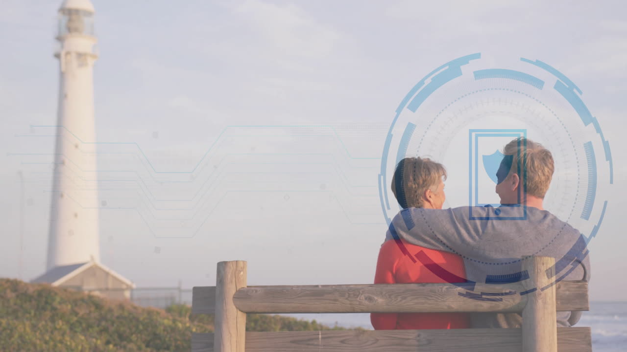 Sitting on bench near lighthouse, couple viewing animation on digital interface