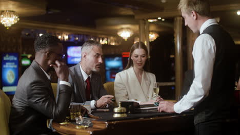 people playing poker at the casino.