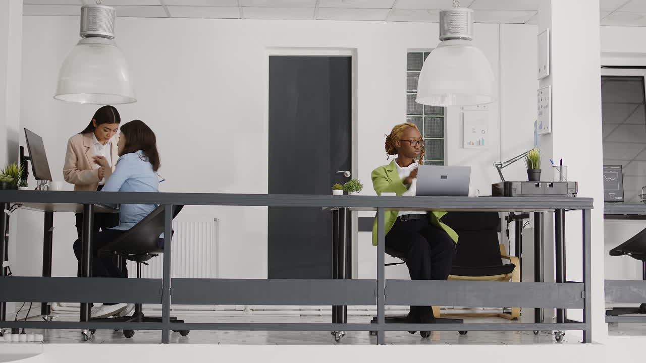 Diverse group of coworkers collaborating in a modern office