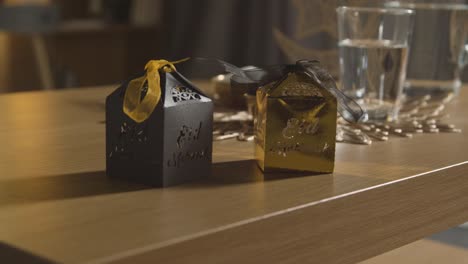 close up of gift boxes on table in muslim home celebrating eid 2