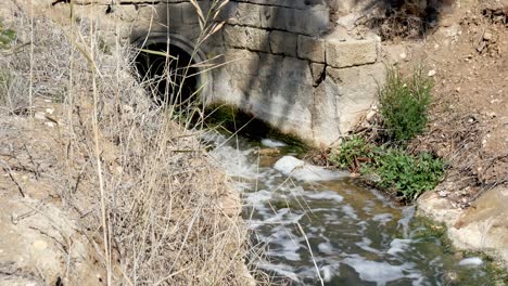 An-irrigation-and-drainage-ditch-in-the-countryside-with-clean-water-flowing