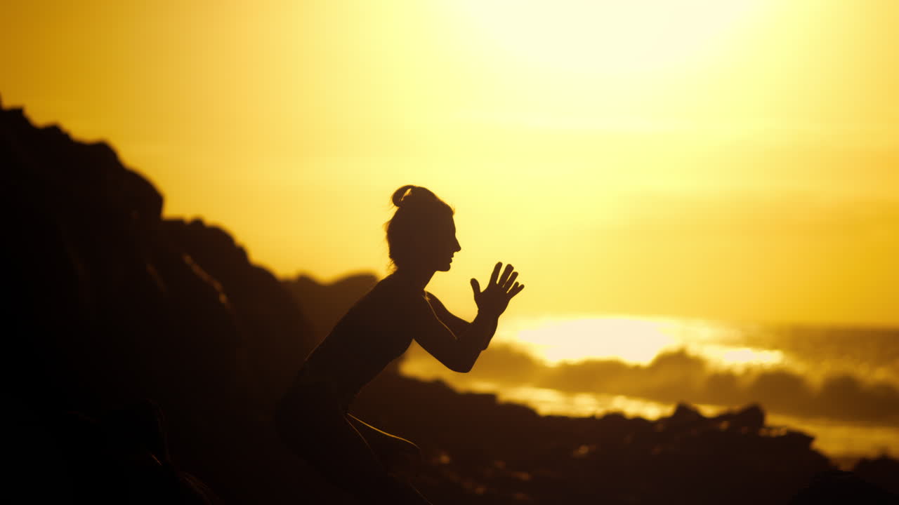 Woman in Yoga Pose at Sunrise