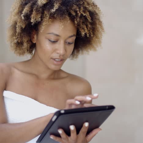 Girl-In-Bath-Towels-Using-Touchpad