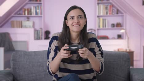 competitive indian girl gamer playing video games