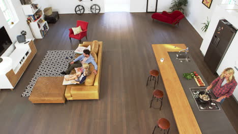 Overhead-Shot-Of-Parents-Having-Cushion-Fight-With-Children