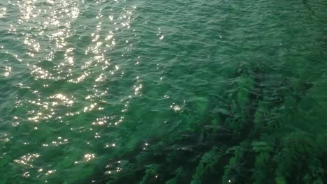 greece sithonia halkidiki sea water afternoon sun reflection drone aerial footage