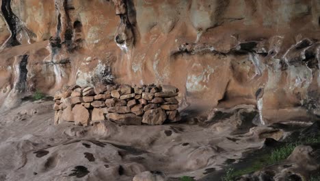 round neolithic cave construction of stacked stones in ancient cavern