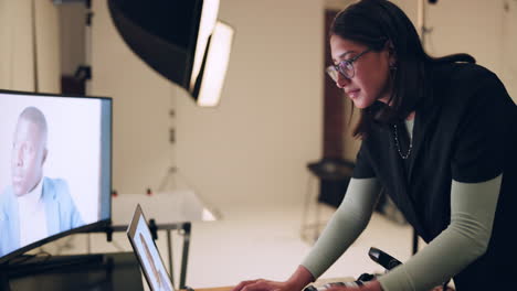 photographer editing photos in a studio