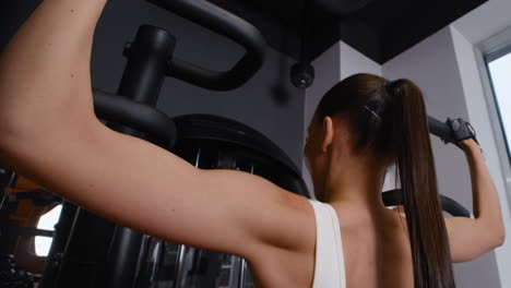woman exercising on gym machine