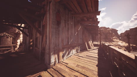 wooden structures under a bright sky in an arid daylight setting