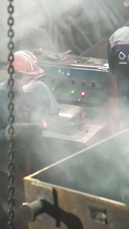 industrial worker operating machinery in a factory