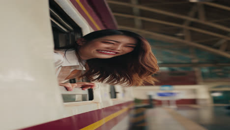woman looking out from train window