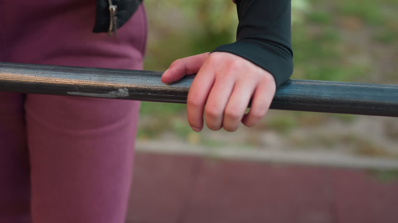 Close up view of gym lover gripping exercise bar with strong hands, focusing on strength and dedication in fitness routine, preparing for next workout session, perfect for sports and fitness footage