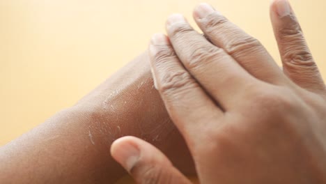 close-up of a hand applying lotion