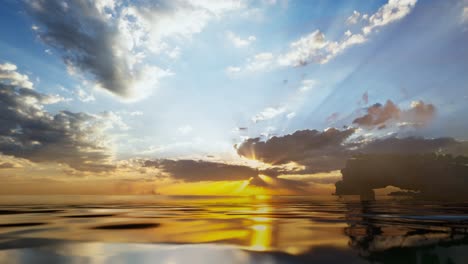 underwater part and sunset skylight splitted by waterline. beautiful clouds and bright sun over sea water