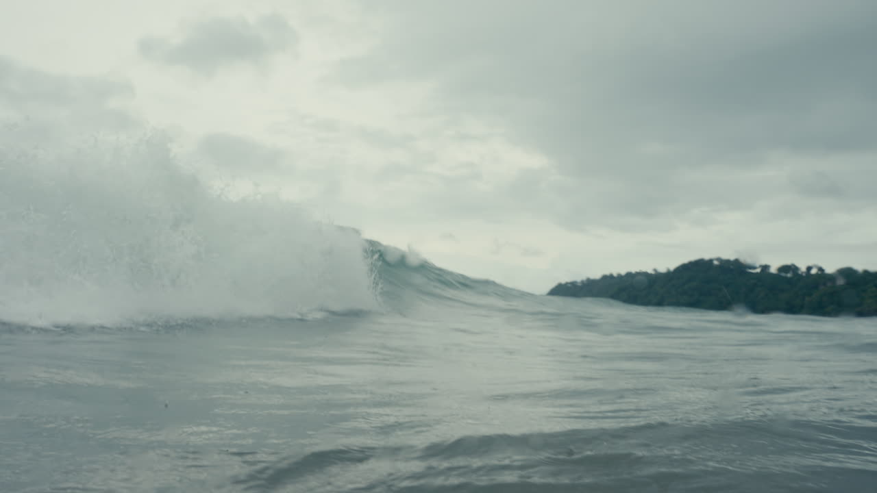 Ocean waves crashing on a cloudy day