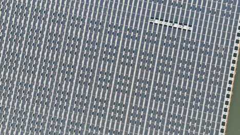 renewable green solar energy from floating solar cell panels in a water of aerial view