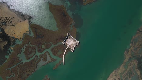 Medieval Fortress Amidst Turquoise Lagoon: A Spectacular View of Butrint&#039;s Entrance from the Ionian Sea in Albania, aerial view