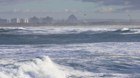 4K-Slow-Motion-Of-Large-Swell-Ocean-Waves-With-White-Wash-And-Coastline-On-Horizon,-Australia