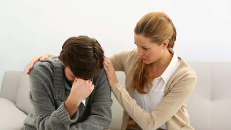 Young-man-being-comforted-by-his-therapist