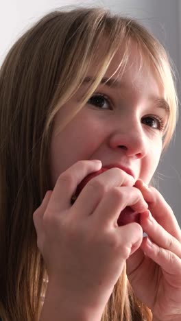 girl eating an apple