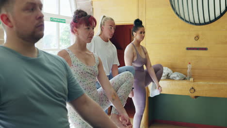 a group of women doing yoga