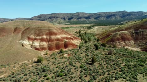 us, oregon, prineville, painted hills, 2025-05-06 - drone view of the beautiful red soils just outside the john day fossil beds national monument