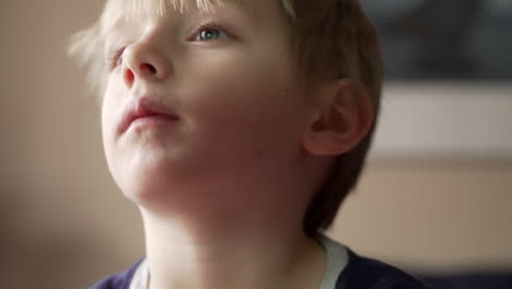 portrait of a cute little boy shaking his head