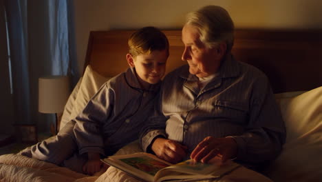 grandfather and grandson reading a bedtime story