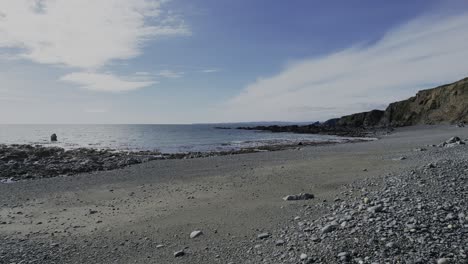 ireland beaches drone flying low over pebble beach remote beach no people waterfords copper coast epic location and seascape