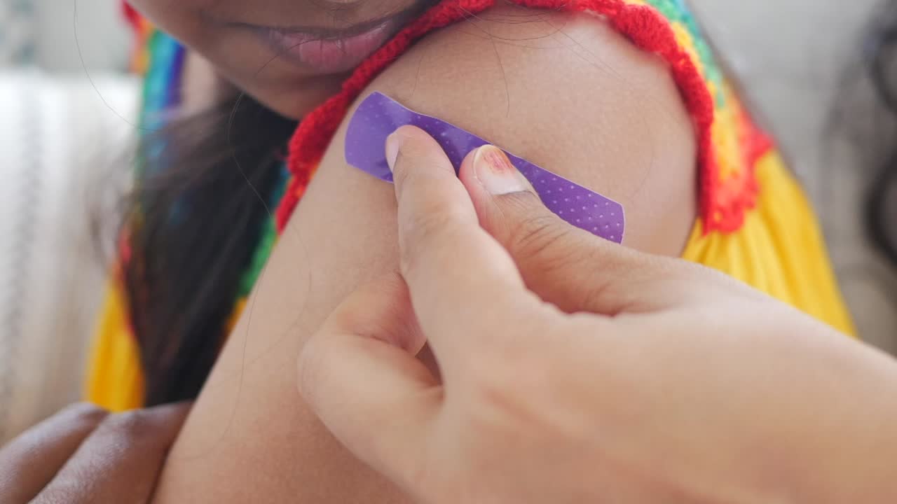 Vaccination with a bandage on arm