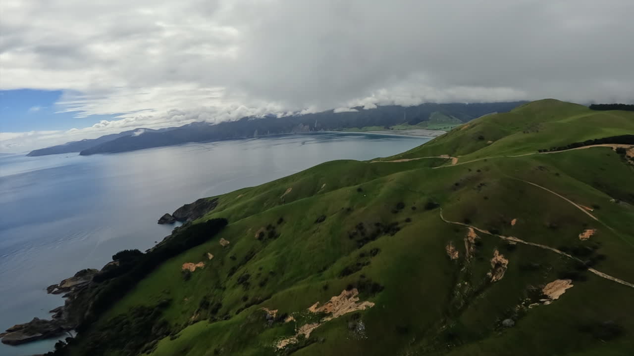 POV Helicopter aerial flying over Pepin Island, near Delaware bay, New Zealand
