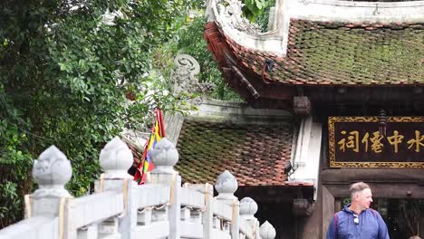 tourists and security at hanoi temple entrance