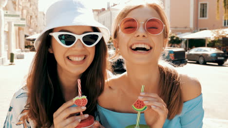 two friends enjoying drinks in the city