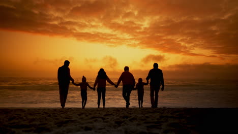 Beach,-holding-hands-and-big-family-at-sunset