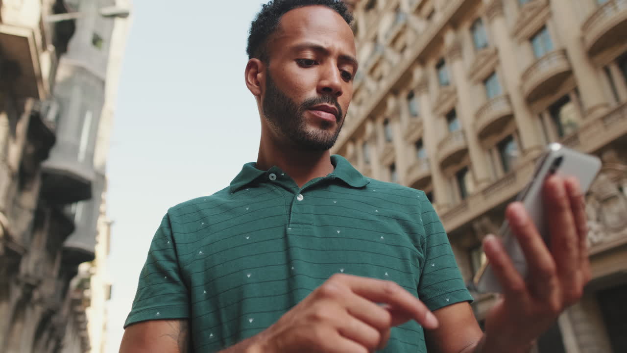 Man using smartphone in the city