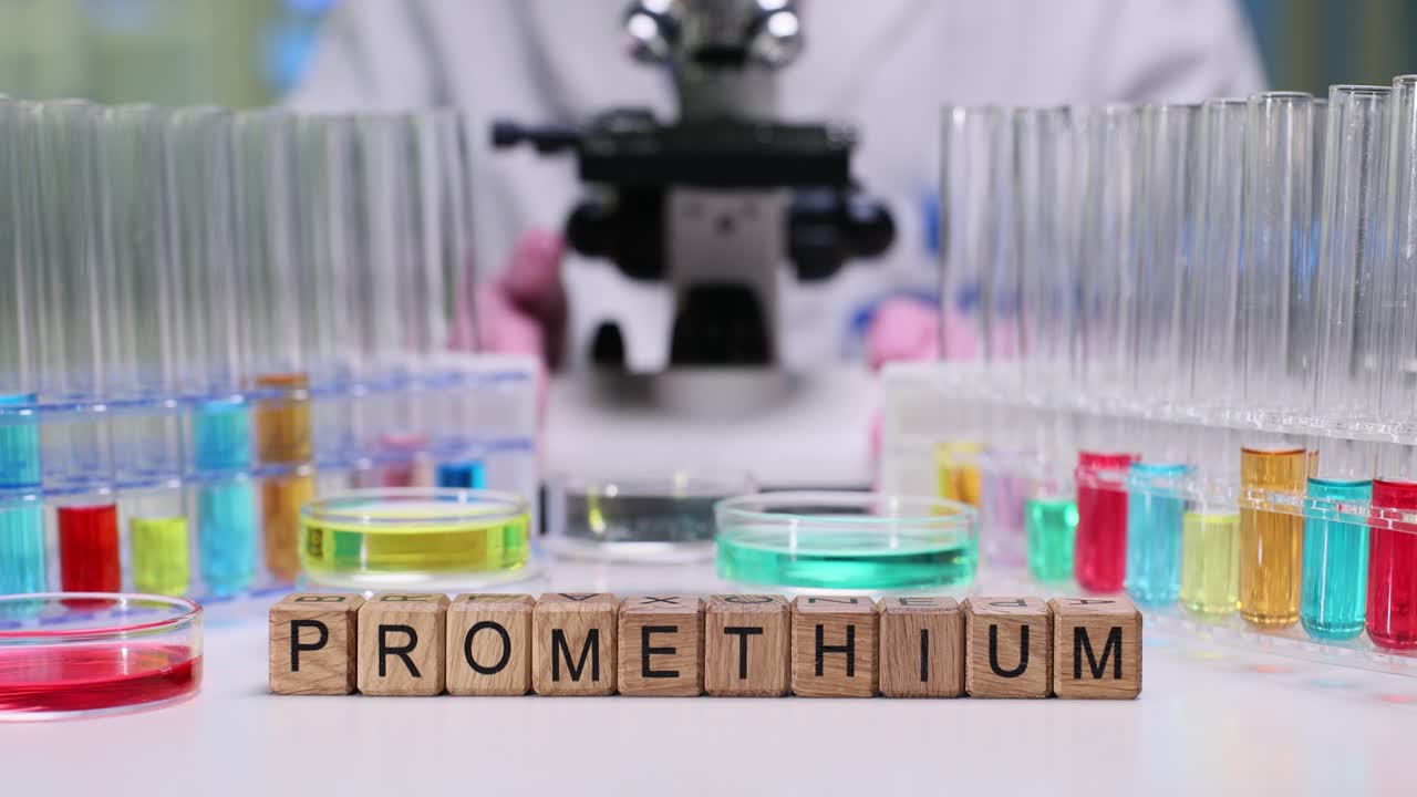 Promethium Word Blocks in a Science Laboratory with Researcher