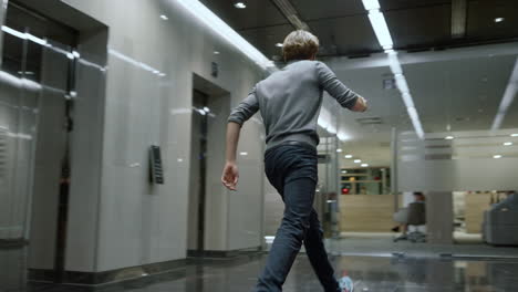 Business people standing in elevator car. Businessman running out of elevator