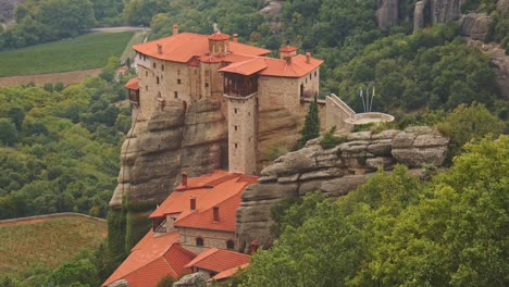 greek monastery st nicholas on top of dramatic vertical cliff