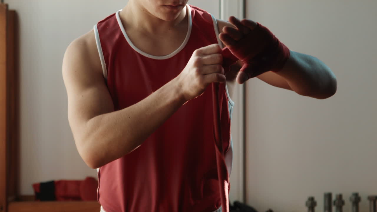 The Young Boxer Wrap Red Bandage On Hands