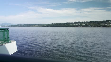 View-over-a-Washington-State-ferry-railing-moving-towards-Mukilteo