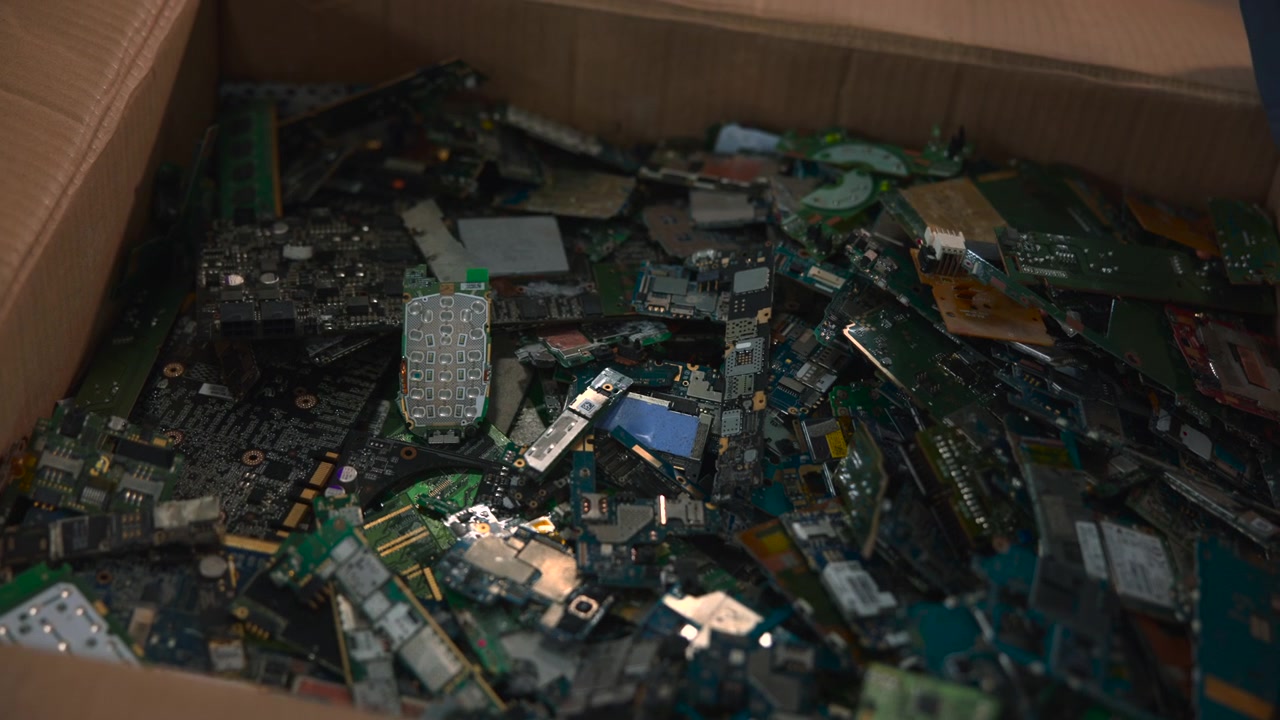 Close View Box Full Of Small Electronic Parts And Circuit Fragments With Gloved Hands Sorting Components