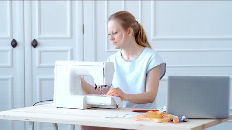 woman sewing at a desk
