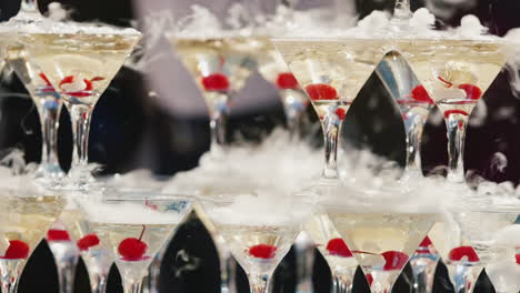 glasses with bubbles and wine stand in several rows 1