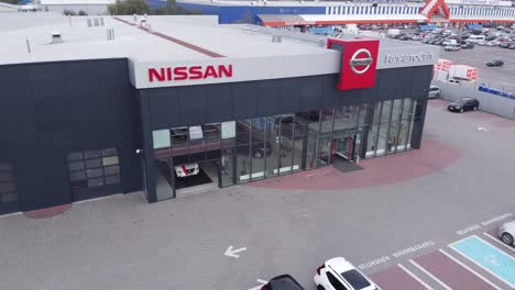 nissan dealership with gift-wrapped car