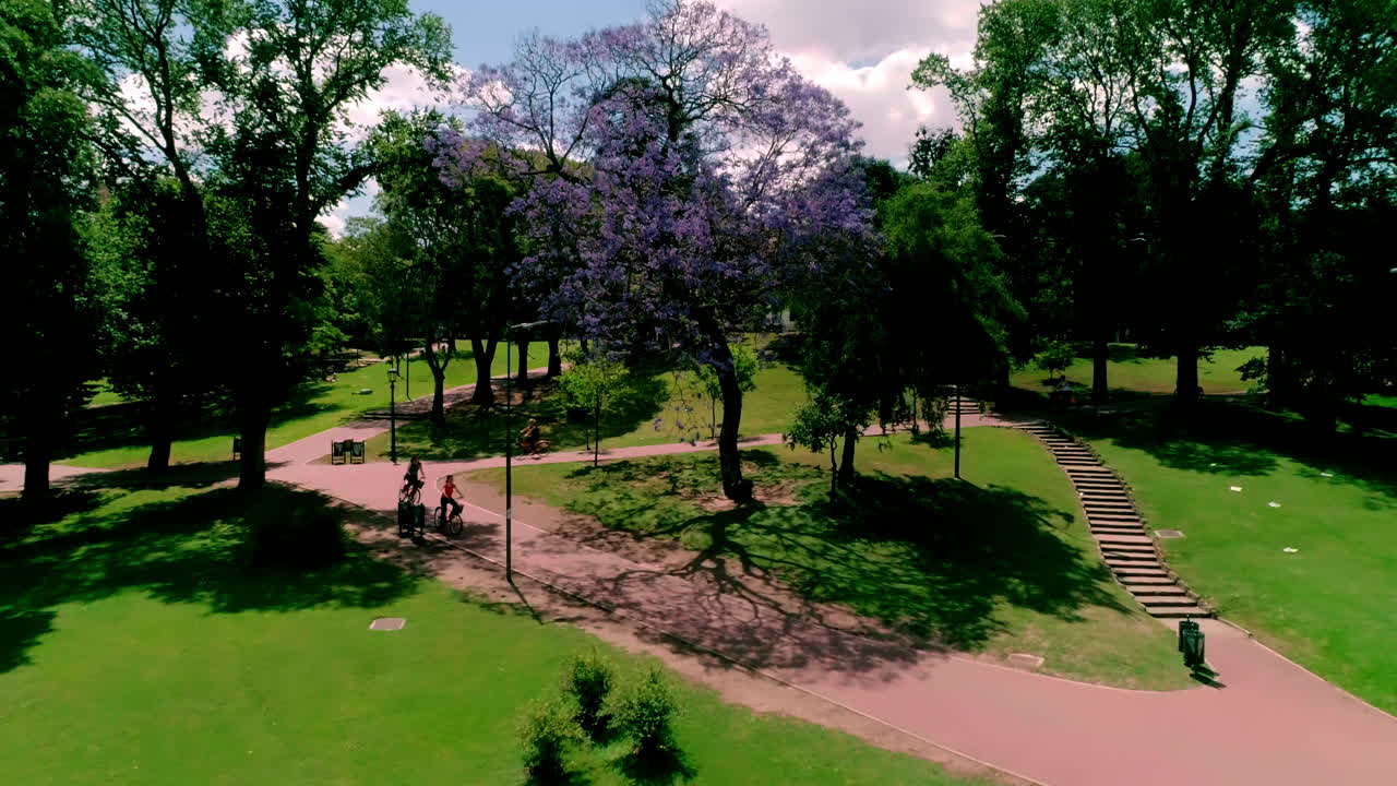 Drone shot of bike tour in park in Buenos Aires, Argentina