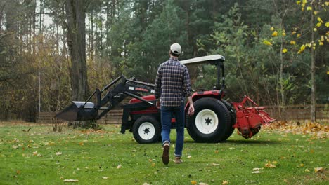 farmer working with tractor in autumn